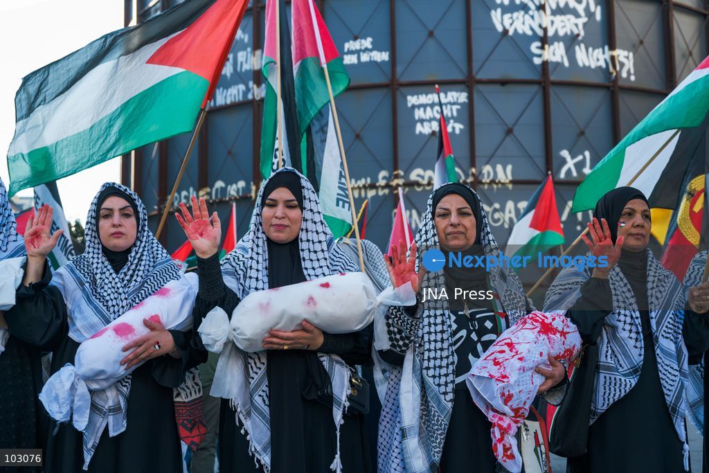 BERLIN, GERMANY, OCTOBER 7, 2026: Demonstrators gather at Checkpoint Charlie in central Berlin to mark three years since the start of the Gaza war. Participants protest against Israel’s military actions in Gaza, which they describe as genocide, and express solidarity with Palestinians. Photo by Nikos Kanistras / JNA Press. (Photo by Nikos Kanistras/JNA Press via Nexpher Images)