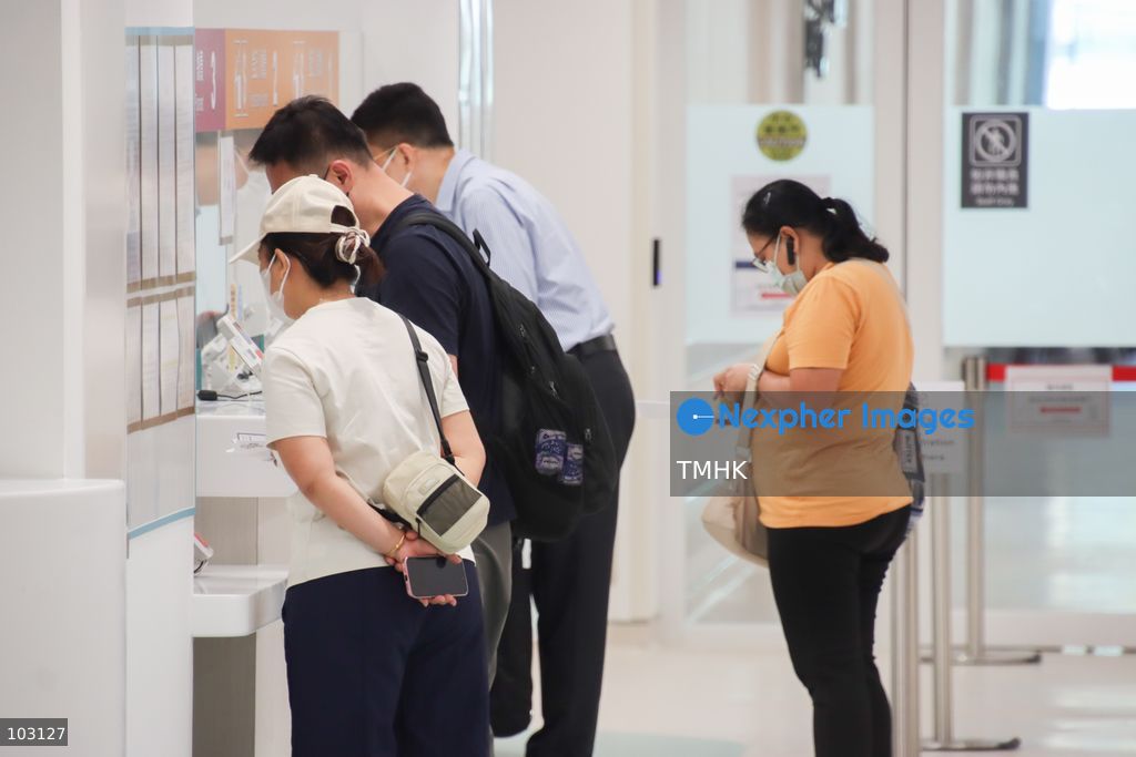 Patients register at the reception counter of the Family Medicine Integrated Centre at Kai Tak Hospital in Hong Kong on October 5, 2026. The hospital began its first phase of operations, with the centre offering around 350 consultation slots per day. (Photo by Gordon Choi/TMHK via Nexpher Images)