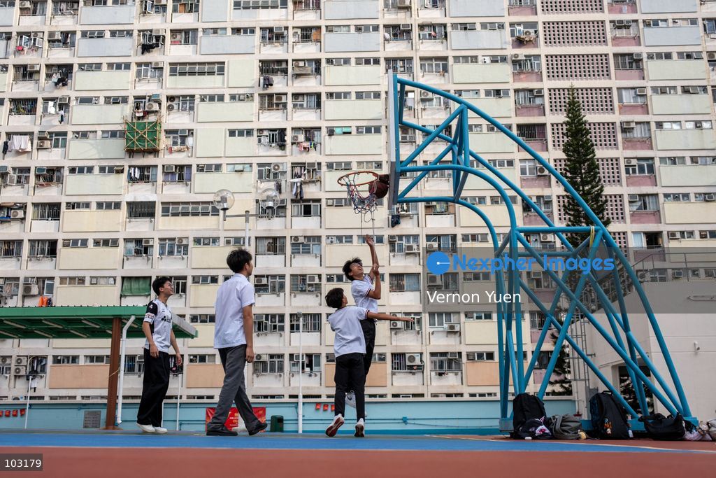 TOP PICS - Students playing basketball at a basketball court at Choi Hung Estate on October 8, 2026 in Hong Kong. (Photo by Vernon Yuen/Nexpher Images)
