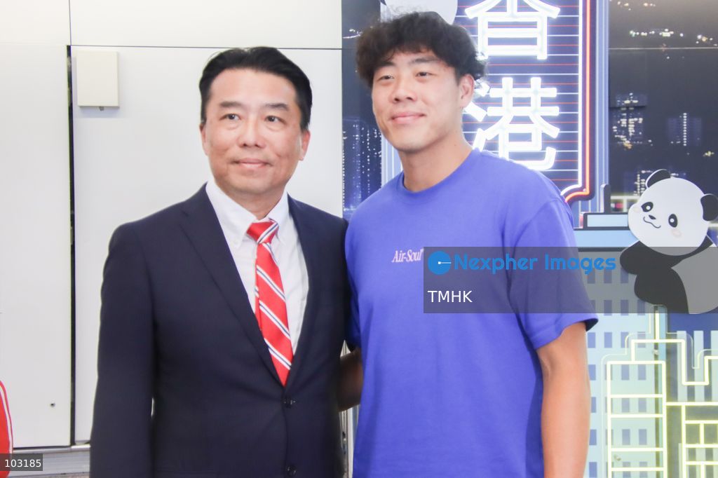 Hong Kong, China tennis player Coleman Wong poses for photographs with his father Wong Yuet-ming upon his arrival at Hong Kong International Airport on October 8, 2026, following his men's singles tennis gold medal victory at the Asian Games. (Photo by Gordon Choi/TMHK via Nexpher Images)