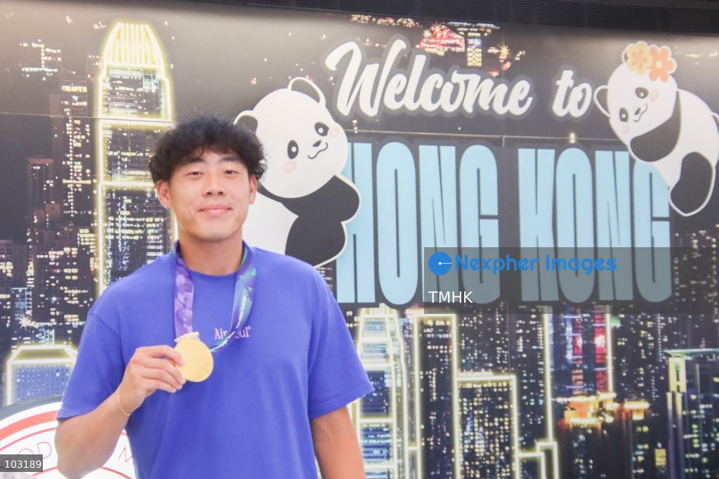 Hong Kong, China tennis player Coleman Wong poses for photographs with his Asian Games men's singles tennis gold medal upon his arrival at Hong Kong International Airport on October 8, 2026. (Photo by Gordon Choi/TMHK via Nexpher Images)