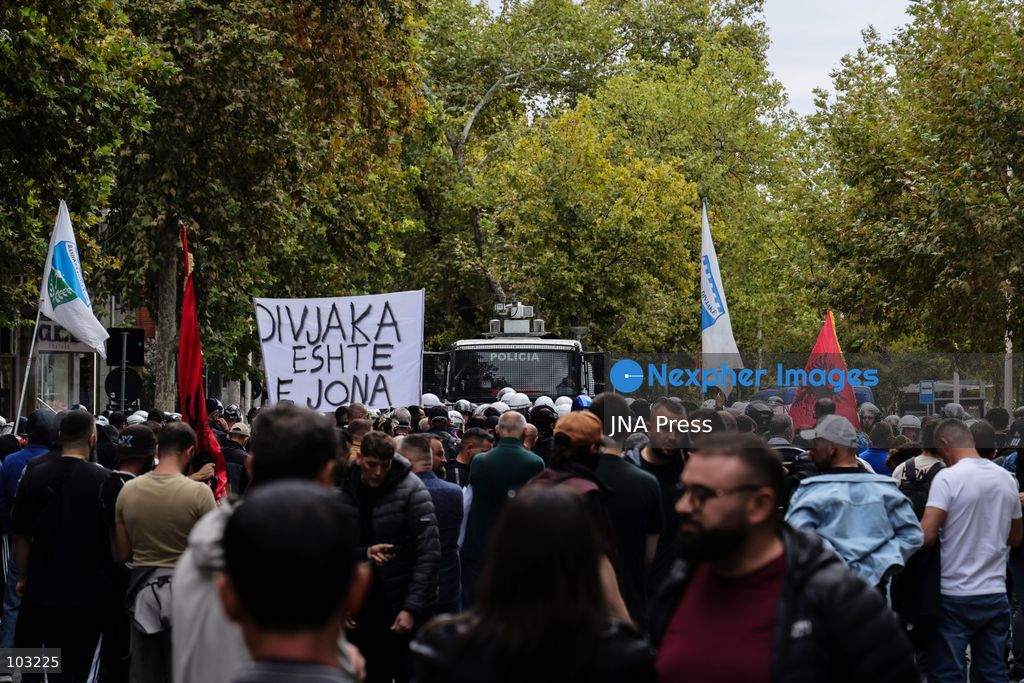 TIRANA, ALBANIA – OCTOBER 8, 2026: Citizens, local activists and supporters of the opposition gather outside the Albanian Parliament as lawmakers debate and vote on proposed changes to the country’s administrative-territorial division. The reform proposes reducing the number of municipalities from 61 to 46 through the merger of 15 existing municipalities, including Divjakë, Poliçan and Memaliaj. Residents and representatives of municipalities affected by the proposed changes joined the protest, calling for their municipalities to be preserved. Protesters displayed banners and slogans opposing the proposed mergers. Tensions escalated between protesters and police, with reports of eggs and smoke-producing devices being thrown and police using tear gas and pepper spray. Several people received first aid after being affected by the spray. Protesters also set fire to garbage bins during the confrontation. The demonstration took place as Parliament considered the proposed territorial reform. Photo by Vlasov Sulaj / JNA Press. (Photo by Vlasov Sulaj/JNA Press via Nexpher Images)