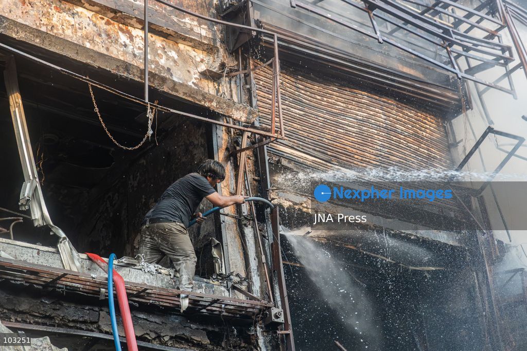 BHOPAL, MADHYA PRADESH, INDIA, OCTOBER 8, 2026: Firefighters battle a major fire at the New Market commercial area in Bhopal on Thursday afternoon. The blaze reportedly started at a fast-food outlet before spreading to several nearby shops, including clothing, kitchenware and mobile phone stores. More than 15 fire engines were deployed to contain the flames as thick smoke rose above the crowded shopping district. Photo by Sauvik Acharyya / JNA Press. (Photo by Sauvik Acharyya/JNA Press via Nexpher Images)