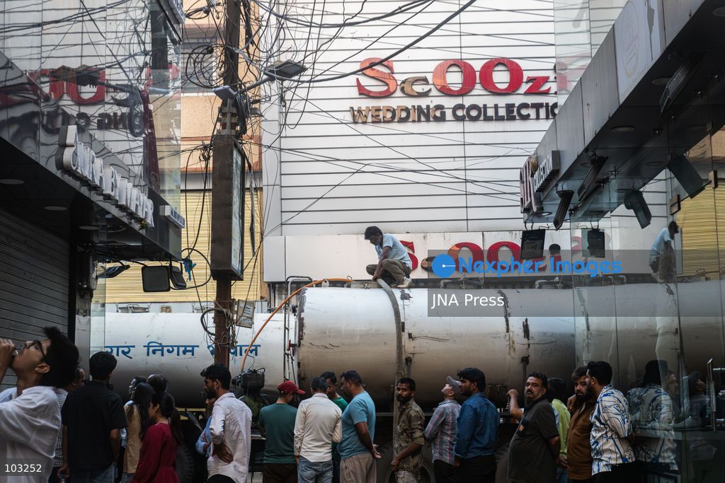 BHOPAL, MADHYA PRADESH, INDIA, OCTOBER 8, 2026: Firefighters battle a major fire at the New Market commercial area in Bhopal on Thursday afternoon. The blaze reportedly started at a fast-food outlet before spreading to several nearby shops, including clothing, kitchenware and mobile phone stores. More than 15 fire engines were deployed to contain the flames as thick smoke rose above the crowded shopping district. Photo by Sauvik Acharyya / JNA Press. (Photo by Sauvik Acharyya/JNA Press via Nexpher Images)