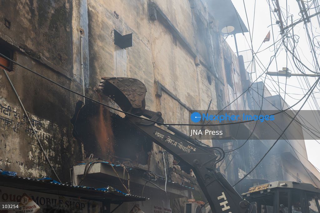 BHOPAL, MADHYA PRADESH, INDIA, OCTOBER 8, 2026: Firefighters battle a major fire at the New Market commercial area in Bhopal on Thursday afternoon. The blaze reportedly started at a fast-food outlet before spreading to several nearby shops, including clothing, kitchenware and mobile phone stores. More than 15 fire engines were deployed to contain the flames as thick smoke rose above the crowded shopping district. Photo by Sauvik Acharyya / JNA Press. (Photo by Sauvik Acharyya/JNA Press via Nexpher Images)