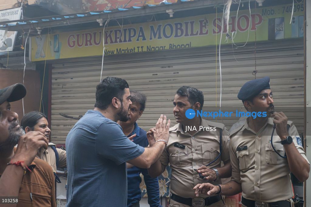 BHOPAL, MADHYA PRADESH, INDIA, OCTOBER 8, 2026: Firefighters battle a major fire at the New Market commercial area in Bhopal on Thursday afternoon. The blaze reportedly started at a fast-food outlet before spreading to several nearby shops, including clothing, kitchenware and mobile phone stores. More than 15 fire engines were deployed to contain the flames as thick smoke rose above the crowded shopping district. Photo by Sauvik Acharyya / JNA Press. (Photo by Sauvik Acharyya/JNA Press via Nexpher Images)