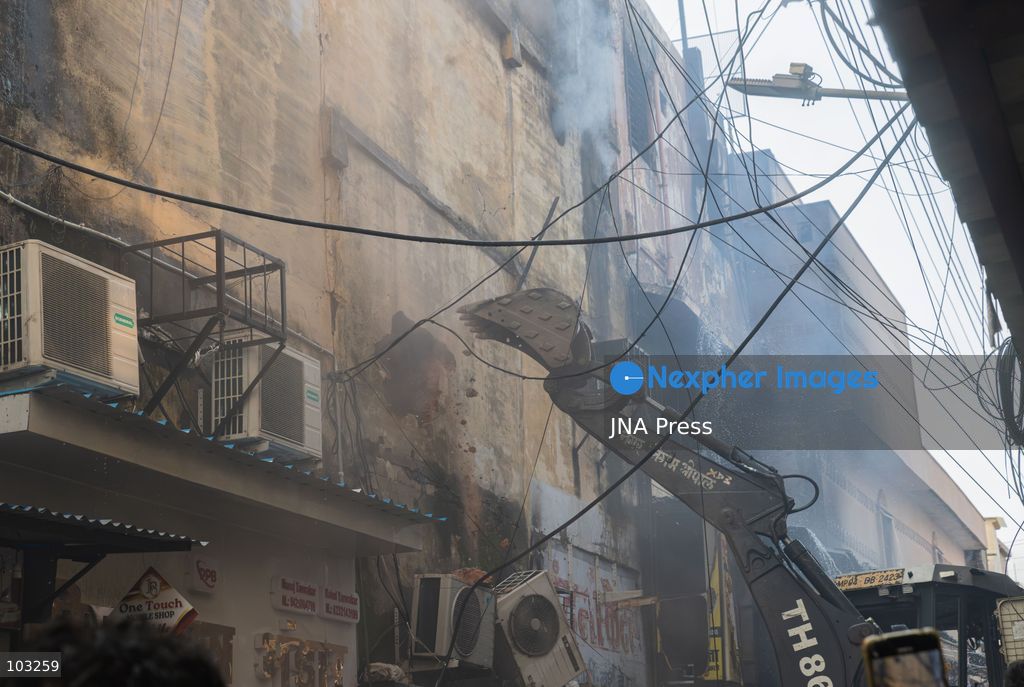 BHOPAL, MADHYA PRADESH, INDIA, OCTOBER 8, 2026: Firefighters battle a major fire at the New Market commercial area in Bhopal on Thursday afternoon. The blaze reportedly started at a fast-food outlet before spreading to several nearby shops, including clothing, kitchenware and mobile phone stores. More than 15 fire engines were deployed to contain the flames as thick smoke rose above the crowded shopping district. Photo by Sauvik Acharyya / JNA Press. (Photo by Sauvik Acharyya/JNA Press via Nexpher Images)
