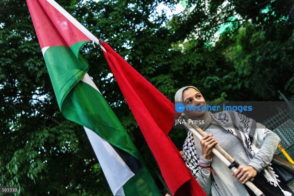 PANAMA CITY, PANAMA, OCTOBER 8, 2026: Pro-Palestinian demonstrators march through central Panama City despite heavy rain, carrying Palestinian flags and banners and chanting in solidarity with Palestinians in Gaza. Participants denounced Israel's military campaign in Gaza and called for an end to the war as they marched through the city center. Photo by Andres Trujillo / JNA Press. (Photo by AndrÃ©s Trujillo/JNA Press via Nexpher Images)