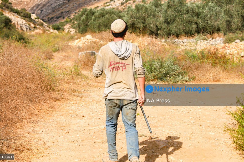DEIR IBZI, OCCUPIED WEST BANK, OCTOBER 9, 2026: Israeli settlers confront Palestinian farmers, international activists and journalists during the annual olive harvest in the village of Deir Ibzi, west of Ramallah. According to the photographer, settlers attacked and harassed those accompanying the farmers, used pepper spray and prevented residents from completing the harvest on their agricultural land. The incident occurred during the olive harvest season, an important source of income for Palestinian farming communities in the occupied West Bank. Photo by Salman Mohsen Alkhatib / JNA Press (Photo by Salman Mohsen Alkhatib/JNA Press via Nexpher Images)