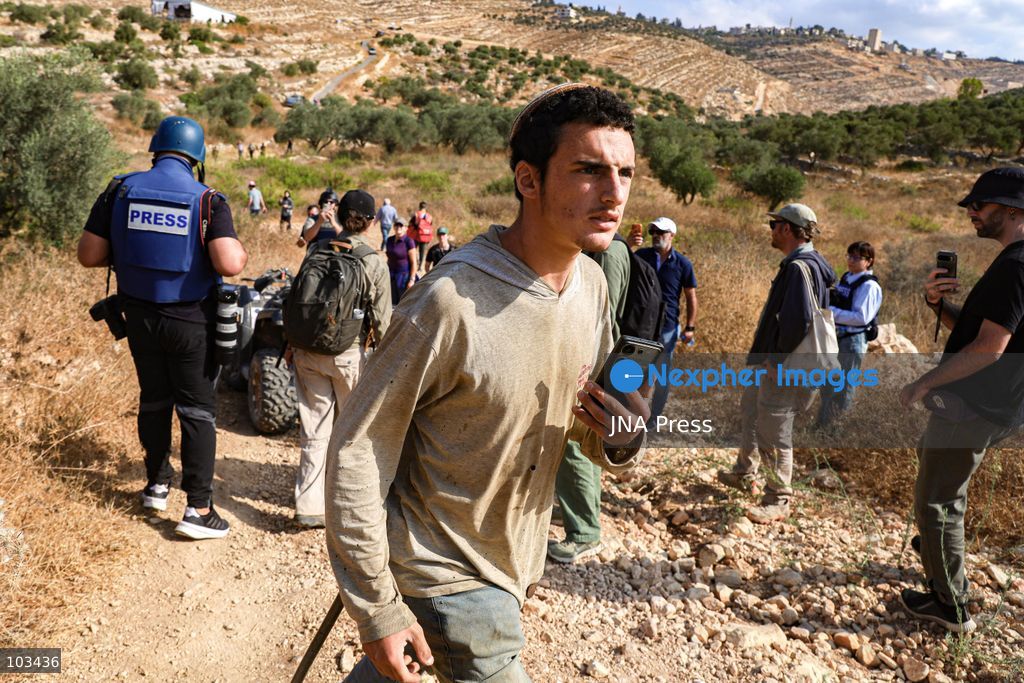 DEIR IBZI, OCCUPIED WEST BANK, OCTOBER 9, 2026: Israeli settlers confront Palestinian farmers, international activists and journalists during the annual olive harvest in the village of Deir Ibzi, west of Ramallah. According to the photographer, settlers attacked and harassed those accompanying the farmers, used pepper spray and prevented residents from completing the harvest on their agricultural land. The incident occurred during the olive harvest season, an important source of income for Palestinian farming communities in the occupied West Bank. Photo by Salman Mohsen Alkhatib / JNA Press (Photo by Salman Mohsen Alkhatib/JNA Press via Nexpher Images)