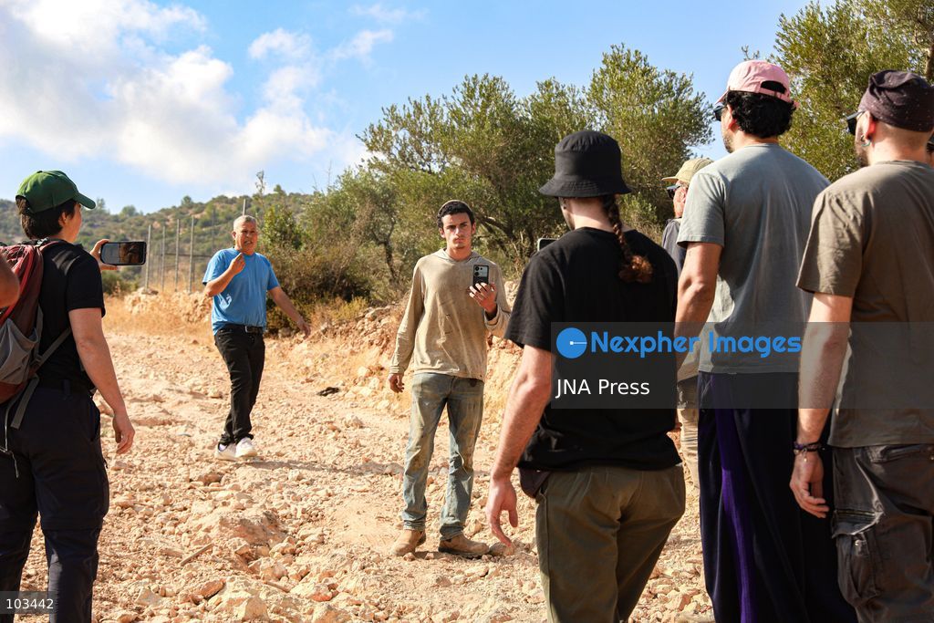 DEIR IBZI, OCCUPIED WEST BANK, OCTOBER 9, 2026: Israeli settlers confront Palestinian farmers, international activists and journalists during the annual olive harvest in the village of Deir Ibzi, west of Ramallah. According to the photographer, settlers attacked and harassed those accompanying the farmers, used pepper spray and prevented residents from completing the harvest on their agricultural land. The incident occurred during the olive harvest season, an important source of income for Palestinian farming communities in the occupied West Bank. Photo by Salman Mohsen Alkhatib / JNA Press (Photo by Salman Mohsen Alkhatib/JNA Press via Nexpher Images)