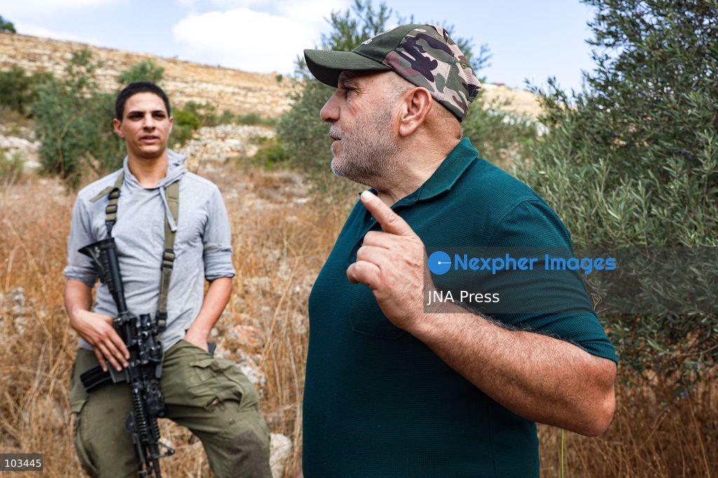 DEIR IBZI, OCCUPIED WEST BANK, OCTOBER 9, 2026: Israeli settlers confront Palestinian farmers, international activists and journalists during the annual olive harvest in the village of Deir Ibzi, west of Ramallah. According to the photographer, settlers attacked and harassed those accompanying the farmers, used pepper spray and prevented residents from completing the harvest on their agricultural land. The incident occurred during the olive harvest season, an important source of income for Palestinian farming communities in the occupied West Bank. Photo by Salman Mohsen Alkhatib / JNA Press (Photo by Salman Mohsen Alkhatib/JNA Press via Nexpher Images)