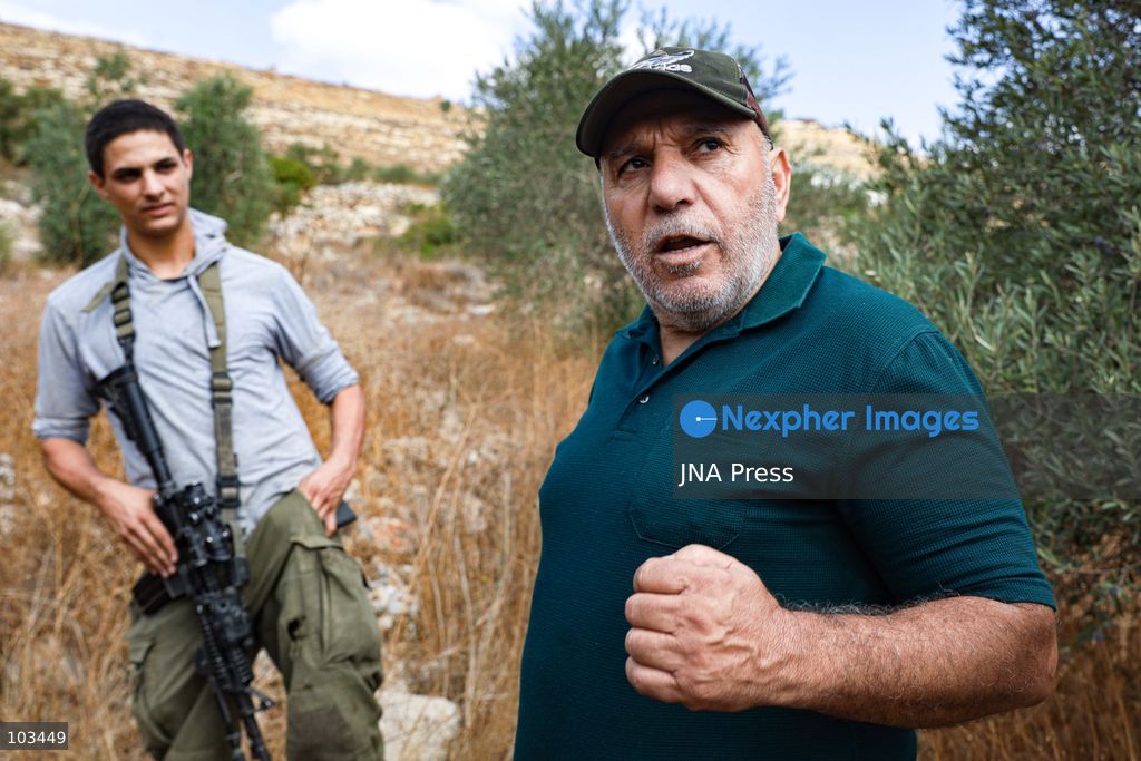 DEIR IBZI, OCCUPIED WEST BANK, OCTOBER 9, 2026: Israeli settlers confront Palestinian farmers, international activists and journalists during the annual olive harvest in the village of Deir Ibzi, west of Ramallah. According to the photographer, settlers attacked and harassed those accompanying the farmers, used pepper spray and prevented residents from completing the harvest on their agricultural land. The incident occurred during the olive harvest season, an important source of income for Palestinian farming communities in the occupied West Bank. Photo by Salman Mohsen Alkhatib / JNA Press (Photo by Salman Mohsen Alkhatib/JNA Press via Nexpher Images)