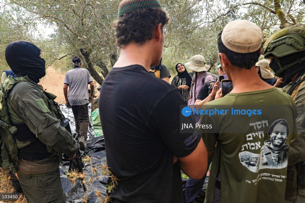DEIR IBZI, OCCUPIED WEST BANK, OCTOBER 9, 2026: Israeli settlers confront Palestinian farmers, international activists and journalists during the annual olive harvest in the village of Deir Ibzi, west of Ramallah. According to the photographer, settlers attacked and harassed those accompanying the farmers, used pepper spray and prevented residents from completing the harvest on their agricultural land. The incident occurred during the olive harvest season, an important source of income for Palestinian farming communities in the occupied West Bank. Photo by Salman Mohsen Alkhatib / JNA Press (Photo by Salman Mohsen Alkhatib/JNA Press via Nexpher Images)