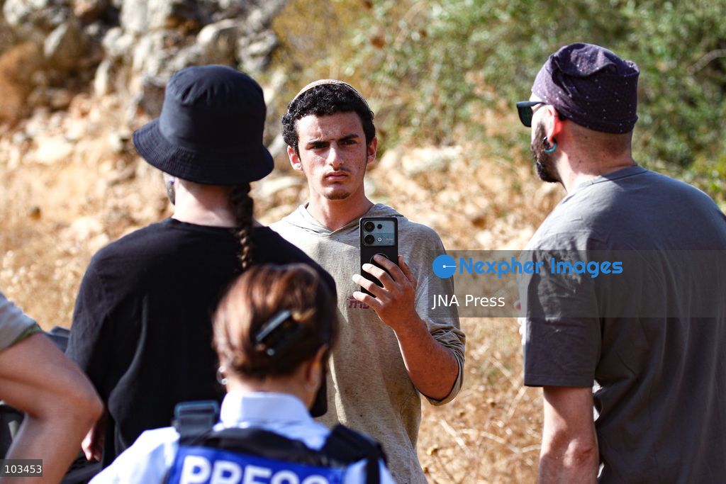 DEIR IBZI, OCCUPIED WEST BANK, OCTOBER 9, 2026: Israeli settlers confront Palestinian farmers, international activists and journalists during the annual olive harvest in the village of Deir Ibzi, west of Ramallah. According to the photographer, settlers attacked and harassed those accompanying the farmers, used pepper spray and prevented residents from completing the harvest on their agricultural land. The incident occurred during the olive harvest season, an important source of income for Palestinian farming communities in the occupied West Bank. Photo by Salman Mohsen Alkhatib / JNA Press (Photo by Salman Mohsen Alkhatib/JNA Press via Nexpher Images)