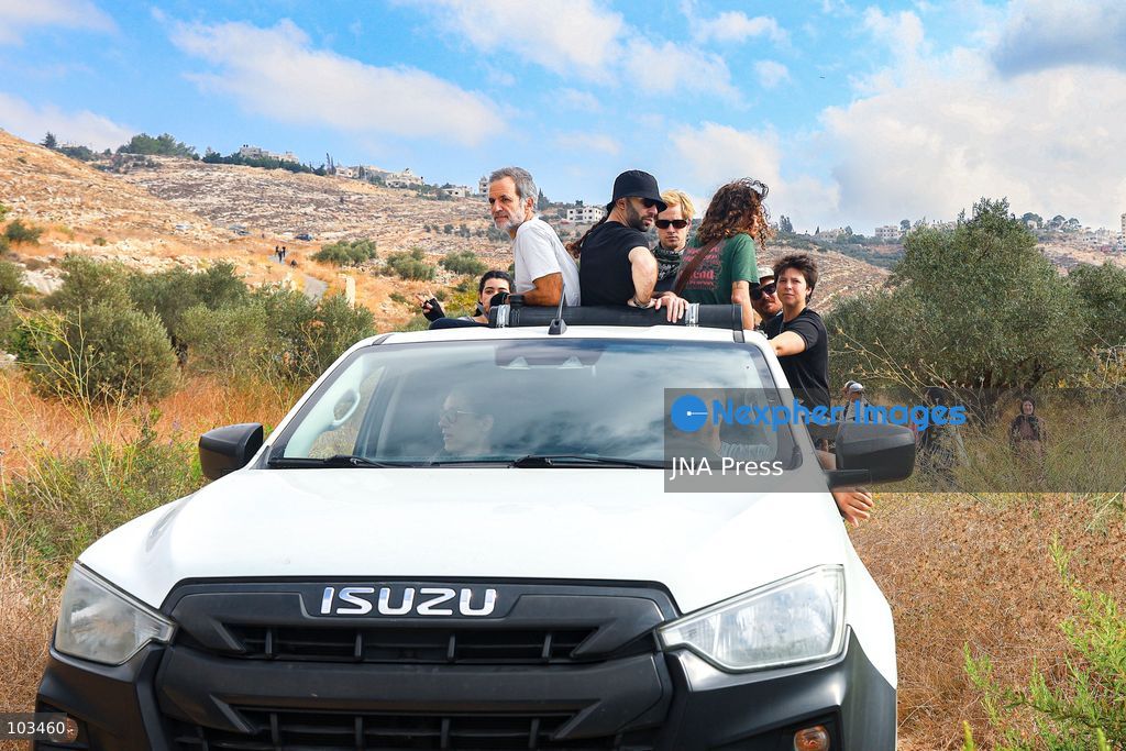 DEIR IBZI, OCCUPIED WEST BANK, OCTOBER 9, 2026: Israeli settlers confront Palestinian farmers, international activists and journalists during the annual olive harvest in the village of Deir Ibzi, west of Ramallah. According to the photographer, settlers attacked and harassed those accompanying the farmers, used pepper spray and prevented residents from completing the harvest on their agricultural land. The incident occurred during the olive harvest season, an important source of income for Palestinian farming communities in the occupied West Bank. Photo by Salman Mohsen Alkhatib / JNA Press (Photo by Salman Mohsen Alkhatib/JNA Press via Nexpher Images)