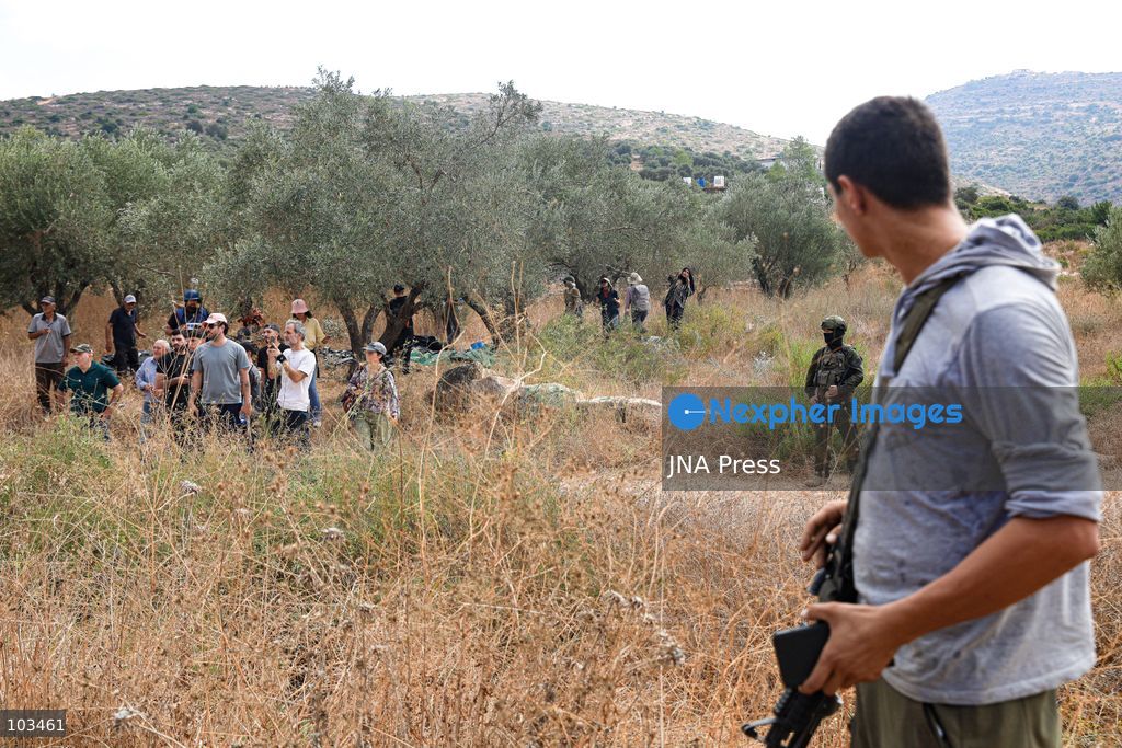 DEIR IBZI, OCCUPIED WEST BANK, OCTOBER 9, 2026: Israeli settlers confront Palestinian farmers, international activists and journalists during the annual olive harvest in the village of Deir Ibzi, west of Ramallah. According to the photographer, settlers attacked and harassed those accompanying the farmers, used pepper spray and prevented residents from completing the harvest on their agricultural land. The incident occurred during the olive harvest season, an important source of income for Palestinian farming communities in the occupied West Bank. Photo by Salman Mohsen Alkhatib / JNA Press (Photo by Salman Mohsen Alkhatib/JNA Press via Nexpher Images)