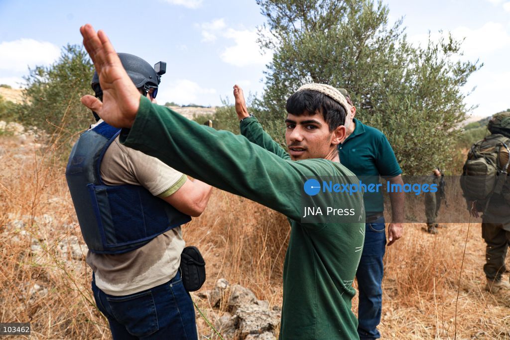 DEIR IBZI, OCCUPIED WEST BANK, OCTOBER 9, 2026: Israeli settlers confront Palestinian farmers, international activists and journalists during the annual olive harvest in the village of Deir Ibzi, west of Ramallah. According to the photographer, settlers attacked and harassed those accompanying the farmers, used pepper spray and prevented residents from completing the harvest on their agricultural land. The incident occurred during the olive harvest season, an important source of income for Palestinian farming communities in the occupied West Bank. Photo by Salman Mohsen Alkhatib / JNA Press (Photo by Salman Mohsen Alkhatib/JNA Press via Nexpher Images)