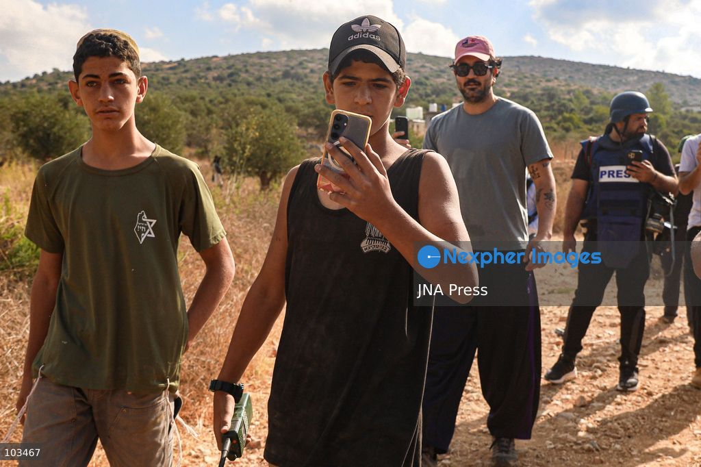 DEIR IBZI, OCCUPIED WEST BANK, OCTOBER 9, 2026: Israeli settlers confront Palestinian farmers, international activists and journalists during the annual olive harvest in the village of Deir Ibzi, west of Ramallah. According to the photographer, settlers attacked and harassed those accompanying the farmers, used pepper spray and prevented residents from completing the harvest on their agricultural land. The incident occurred during the olive harvest season, an important source of income for Palestinian farming communities in the occupied West Bank. Photo by Salman Mohsen Alkhatib / JNA Press (Photo by Salman Mohsen Alkhatib/JNA Press via Nexpher Images)
