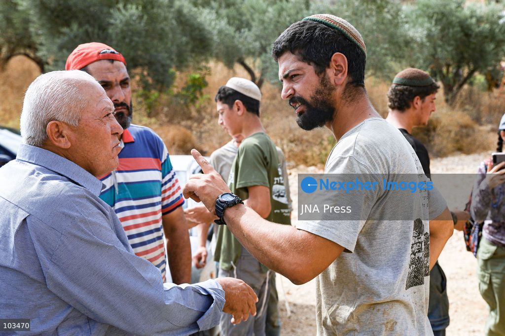 DEIR IBZI, OCCUPIED WEST BANK, OCTOBER 9, 2026: Israeli settlers confront Palestinian farmers, international activists and journalists during the annual olive harvest in the village of Deir Ibzi, west of Ramallah. According to the photographer, settlers attacked and harassed those accompanying the farmers, used pepper spray and prevented residents from completing the harvest on their agricultural land. The incident occurred during the olive harvest season, an important source of income for Palestinian farming communities in the occupied West Bank. Photo by Salman Mohsen Alkhatib / JNA Press (Photo by Salman Mohsen Alkhatib/JNA Press via Nexpher Images)