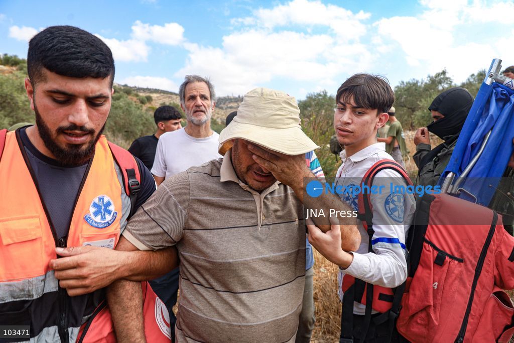 DEIR IBZI, OCCUPIED WEST BANK, OCTOBER 9, 2026: Israeli settlers confront Palestinian farmers, international activists and journalists during the annual olive harvest in the village of Deir Ibzi, west of Ramallah. According to the photographer, settlers attacked and harassed those accompanying the farmers, used pepper spray and prevented residents from completing the harvest on their agricultural land. The incident occurred during the olive harvest season, an important source of income for Palestinian farming communities in the occupied West Bank. Photo by Salman Mohsen Alkhatib / JNA Press (Photo by Salman Mohsen Alkhatib/JNA Press via Nexpher Images)