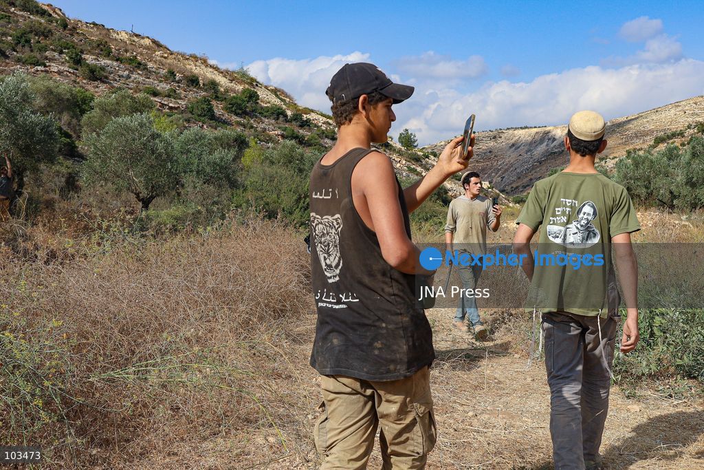 DEIR IBZI, OCCUPIED WEST BANK, OCTOBER 9, 2026: Israeli settlers confront Palestinian farmers, international activists and journalists during the annual olive harvest in the village of Deir Ibzi, west of Ramallah. According to the photographer, settlers attacked and harassed those accompanying the farmers, used pepper spray and prevented residents from completing the harvest on their agricultural land. The incident occurred during the olive harvest season, an important source of income for Palestinian farming communities in the occupied West Bank. Photo by Salman Mohsen Alkhatib / JNA Press (Photo by Salman Mohsen Alkhatib/JNA Press via Nexpher Images)