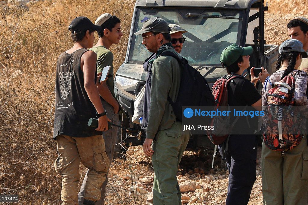 DEIR IBZI, OCCUPIED WEST BANK, OCTOBER 9, 2026: Israeli settlers confront Palestinian farmers, international activists and journalists during the annual olive harvest in the village of Deir Ibzi, west of Ramallah. According to the photographer, settlers attacked and harassed those accompanying the farmers, used pepper spray and prevented residents from completing the harvest on their agricultural land. The incident occurred during the olive harvest season, an important source of income for Palestinian farming communities in the occupied West Bank. Photo by Salman Mohsen Alkhatib / JNA Press (Photo by Salman Mohsen Alkhatib/JNA Press via Nexpher Images)