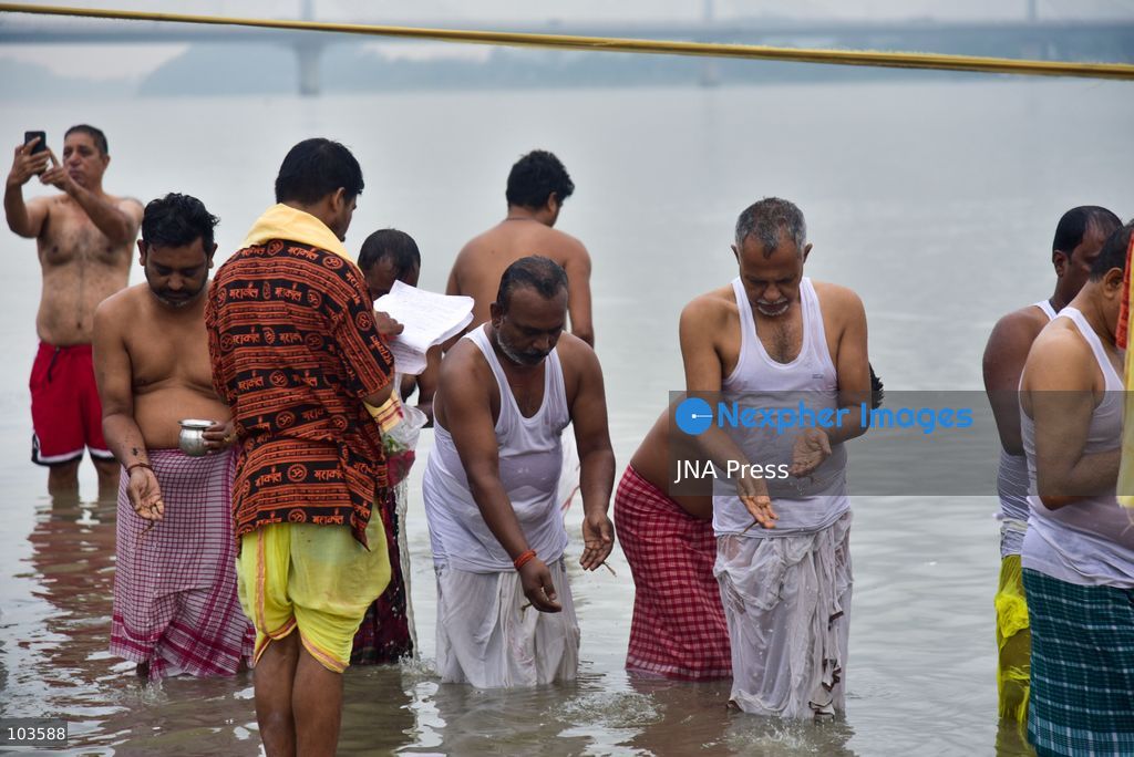 GUWAHATI, ASSAM, INDIA – OCTOBER 10, 2026: Hindu devotees perform the Tarpan ritual on the banks of the Brahmaputra River in Guwahati on the final day of Pitru Paksha, a period dedicated to honoring deceased ancestors in Hindu tradition. During Tarpan, devotees offer water and prayers as an act of remembrance and respect for their forefathers. Pitru Paksha is observed according to the Hindu lunar calendar and is traditionally marked by rituals intended to honor departed family members and seek blessings for their souls. The Brahmaputra riverbank is among the locations where devotees gather to perform these ancestral rites. The ritual reflects the continuing importance of family remembrance and religious observance in Hindu communities across India. Photo by Hafiz Ahmed / JNA Press. (Photo by Hafiz Ahmed/JNA Press via Nexpher Images)