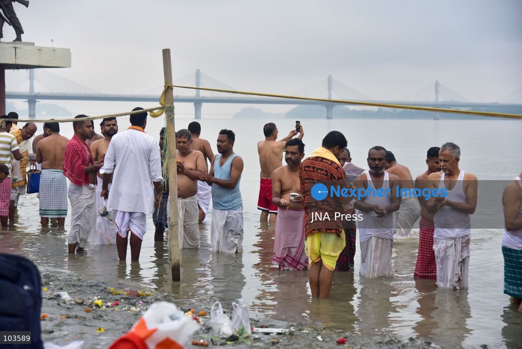 GUWAHATI, ASSAM, INDIA – OCTOBER 10, 2026: Hindu devotees perform the Tarpan ritual on the banks of the Brahmaputra River in Guwahati on the final day of Pitru Paksha, a period dedicated to honoring deceased ancestors in Hindu tradition. During Tarpan, devotees offer water and prayers as an act of remembrance and respect for their forefathers. Pitru Paksha is observed according to the Hindu lunar calendar and is traditionally marked by rituals intended to honor departed family members and seek blessings for their souls. The Brahmaputra riverbank is among the locations where devotees gather to perform these ancestral rites. The ritual reflects the continuing importance of family remembrance and religious observance in Hindu communities across India. Photo by Hafiz Ahmed / JNA Press. (Photo by Hafiz Ahmed/JNA Press via Nexpher Images)