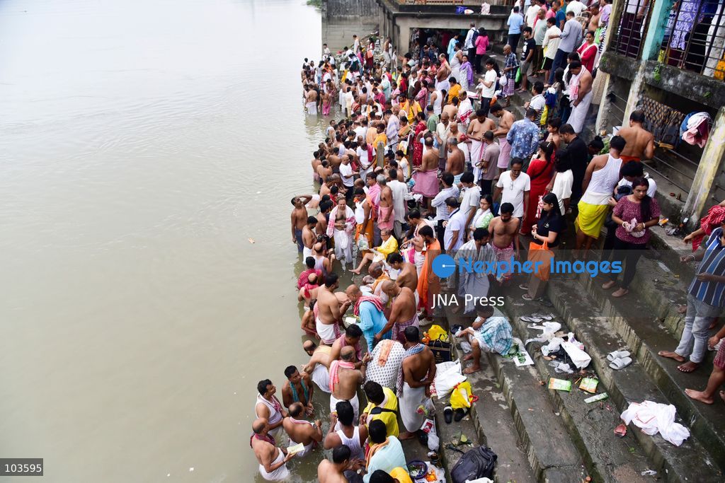 GUWAHATI, ASSAM, INDIA – OCTOBER 10, 2026: Hindu devotees perform the Tarpan ritual on the banks of the Brahmaputra River in Guwahati on the final day of Pitru Paksha, a period dedicated to honoring deceased ancestors in Hindu tradition. During Tarpan, devotees offer water and prayers as an act of remembrance and respect for their forefathers. Pitru Paksha is observed according to the Hindu lunar calendar and is traditionally marked by rituals intended to honor departed family members and seek blessings for their souls. The Brahmaputra riverbank is among the locations where devotees gather to perform these ancestral rites. The ritual reflects the continuing importance of family remembrance and religious observance in Hindu communities across India. Photo by Hafiz Ahmed / JNA Press. (Photo by Hafiz Ahmed/JNA Press via Nexpher Images)