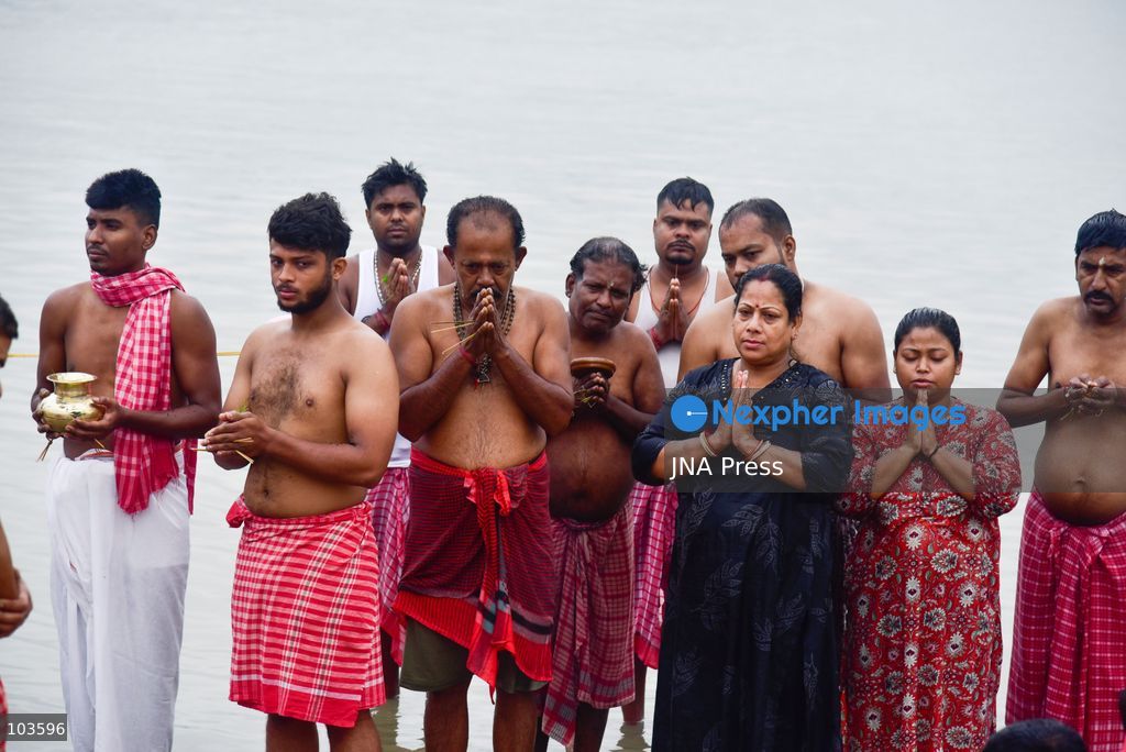 GUWAHATI, ASSAM, INDIA – OCTOBER 10, 2026: Hindu devotees perform the Tarpan ritual on the banks of the Brahmaputra River in Guwahati on the final day of Pitru Paksha, a period dedicated to honoring deceased ancestors in Hindu tradition. During Tarpan, devotees offer water and prayers as an act of remembrance and respect for their forefathers. Pitru Paksha is observed according to the Hindu lunar calendar and is traditionally marked by rituals intended to honor departed family members and seek blessings for their souls. The Brahmaputra riverbank is among the locations where devotees gather to perform these ancestral rites. The ritual reflects the continuing importance of family remembrance and religious observance in Hindu communities across India. Photo by Hafiz Ahmed / JNA Press. (Photo by Hafiz Ahmed/JNA Press via Nexpher Images)