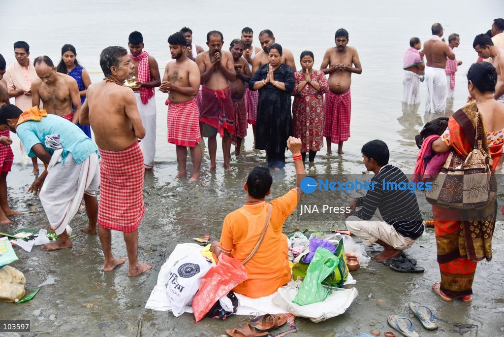 GUWAHATI, ASSAM, INDIA – OCTOBER 10, 2026: Hindu devotees perform the Tarpan ritual on the banks of the Brahmaputra River in Guwahati on the final day of Pitru Paksha, a period dedicated to honoring deceased ancestors in Hindu tradition. During Tarpan, devotees offer water and prayers as an act of remembrance and respect for their forefathers. Pitru Paksha is observed according to the Hindu lunar calendar and is traditionally marked by rituals intended to honor departed family members and seek blessings for their souls. The Brahmaputra riverbank is among the locations where devotees gather to perform these ancestral rites. The ritual reflects the continuing importance of family remembrance and religious observance in Hindu communities across India. Photo by Hafiz Ahmed / JNA Press. (Photo by Hafiz Ahmed/JNA Press via Nexpher Images)
