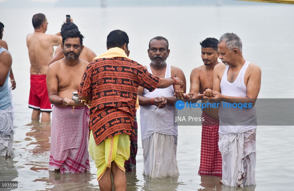 GUWAHATI, ASSAM, INDIA – OCTOBER 10, 2026: Hindu devotees perform the Tarpan ritual on the banks of the Brahmaputra River in Guwahati on the final day of Pitru Paksha, a period dedicated to honoring deceased ancestors in Hindu tradition. During Tarpan, devotees offer water and prayers as an act of remembrance and respect for their forefathers. Pitru Paksha is observed according to the Hindu lunar calendar and is traditionally marked by rituals intended to honor departed family members and seek blessings for their souls. The Brahmaputra riverbank is among the locations where devotees gather to perform these ancestral rites. The ritual reflects the continuing importance of family remembrance and religious observance in Hindu communities across India. Photo by Hafiz Ahmed / JNA Press. (Photo by Hafiz Ahmed/JNA Press via Nexpher Images)