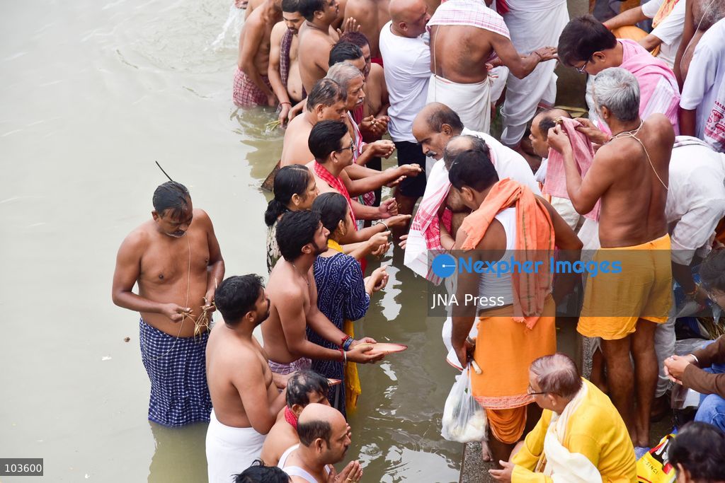GUWAHATI, ASSAM, INDIA – OCTOBER 10, 2026: Hindu devotees perform the Tarpan ritual on the banks of the Brahmaputra River in Guwahati on the final day of Pitru Paksha, a period dedicated to honoring deceased ancestors in Hindu tradition. During Tarpan, devotees offer water and prayers as an act of remembrance and respect for their forefathers. Pitru Paksha is observed according to the Hindu lunar calendar and is traditionally marked by rituals intended to honor departed family members and seek blessings for their souls. The Brahmaputra riverbank is among the locations where devotees gather to perform these ancestral rites. The ritual reflects the continuing importance of family remembrance and religious observance in Hindu communities across India. Photo by Hafiz Ahmed / JNA Press. (Photo by Hafiz Ahmed/JNA Press via Nexpher Images)