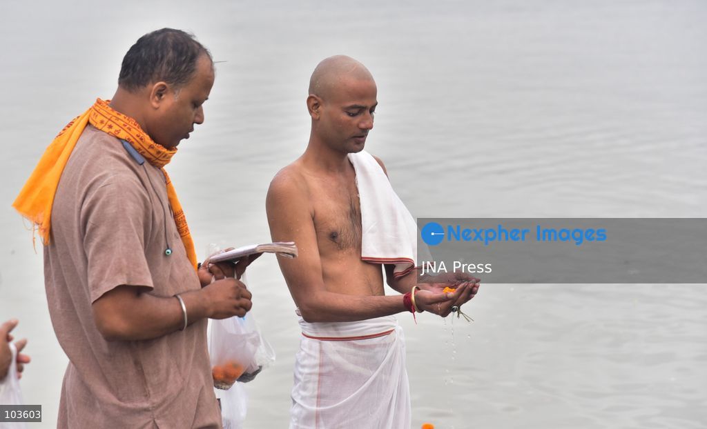 GUWAHATI, ASSAM, INDIA – OCTOBER 10, 2026: Hindu devotees perform the Tarpan ritual on the banks of the Brahmaputra River in Guwahati on the final day of Pitru Paksha, a period dedicated to honoring deceased ancestors in Hindu tradition. During Tarpan, devotees offer water and prayers as an act of remembrance and respect for their forefathers. Pitru Paksha is observed according to the Hindu lunar calendar and is traditionally marked by rituals intended to honor departed family members and seek blessings for their souls. The Brahmaputra riverbank is among the locations where devotees gather to perform these ancestral rites. The ritual reflects the continuing importance of family remembrance and religious observance in Hindu communities across India. Photo by Hafiz Ahmed / JNA Press. (Photo by Hafiz Ahmed/JNA Press via Nexpher Images)