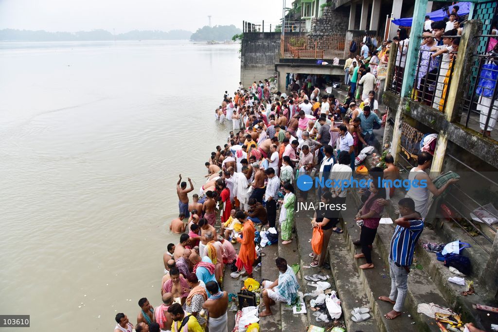 GUWAHATI, ASSAM, INDIA – OCTOBER 10, 2026: Hindu devotees perform the Tarpan ritual on the banks of the Brahmaputra River in Guwahati on the final day of Pitru Paksha, a period dedicated to honoring deceased ancestors in Hindu tradition. During Tarpan, devotees offer water and prayers as an act of remembrance and respect for their forefathers. Pitru Paksha is observed according to the Hindu lunar calendar and is traditionally marked by rituals intended to honor departed family members and seek blessings for their souls. The Brahmaputra riverbank is among the locations where devotees gather to perform these ancestral rites. The ritual reflects the continuing importance of family remembrance and religious observance in Hindu communities across India. Photo by Hafiz Ahmed / JNA Press. (Photo by Hafiz Ahmed/JNA Press via Nexpher Images)