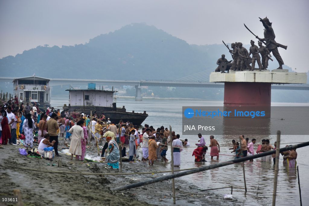 GUWAHATI, ASSAM, INDIA – OCTOBER 10, 2026: Hindu devotees perform the Tarpan ritual on the banks of the Brahmaputra River in Guwahati on the final day of Pitru Paksha, a period dedicated to honoring deceased ancestors in Hindu tradition. During Tarpan, devotees offer water and prayers as an act of remembrance and respect for their forefathers. Pitru Paksha is observed according to the Hindu lunar calendar and is traditionally marked by rituals intended to honor departed family members and seek blessings for their souls. The Brahmaputra riverbank is among the locations where devotees gather to perform these ancestral rites. The ritual reflects the continuing importance of family remembrance and religious observance in Hindu communities across India. Photo by Hafiz Ahmed / JNA Press. (Photo by Hafiz Ahmed/JNA Press via Nexpher Images)