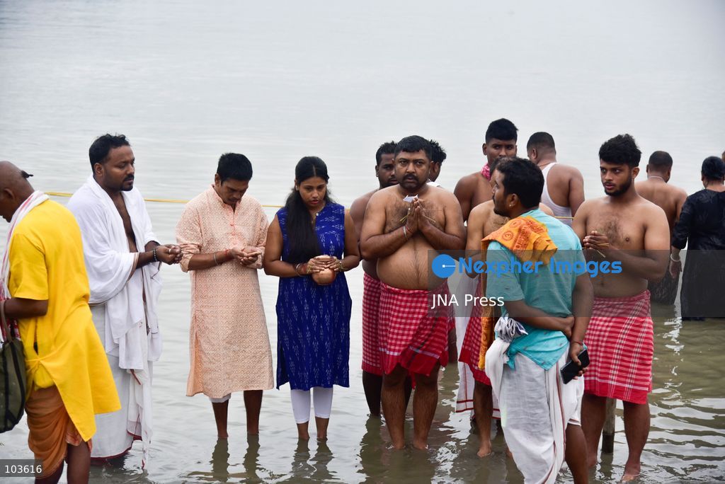 GUWAHATI, ASSAM, INDIA – OCTOBER 10, 2026: Hindu devotees perform the Tarpan ritual on the banks of the Brahmaputra River in Guwahati on the final day of Pitru Paksha, a period dedicated to honoring deceased ancestors in Hindu tradition. During Tarpan, devotees offer water and prayers as an act of remembrance and respect for their forefathers. Pitru Paksha is observed according to the Hindu lunar calendar and is traditionally marked by rituals intended to honor departed family members and seek blessings for their souls. The Brahmaputra riverbank is among the locations where devotees gather to perform these ancestral rites. The ritual reflects the continuing importance of family remembrance and religious observance in Hindu communities across India. Photo by Hafiz Ahmed / JNA Press. (Photo by Hafiz Ahmed/JNA Press via Nexpher Images)