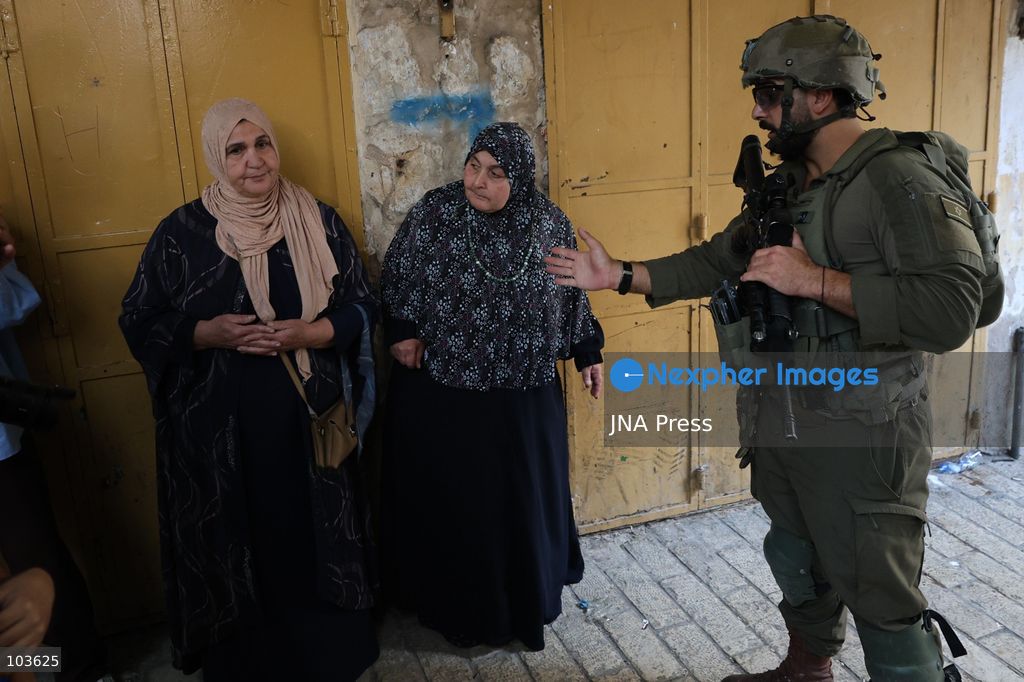 HEBRON, OCCUPIED WEST BANK, OCTOBER 10, 2026: Israeli settlers enter Hebron's Old City under the protection of Israeli forces during an organized visit to the area. Israeli soldiers deployed along streets and around the group as settlers moved through the Old City, where Israeli settlers and Palestinian residents live in close proximity amid longstanding tensions and movement restrictions. Photo by Mosab Shawer / JNA Press. (Photo by Mosab shawer/JNA Press via Nexpher Images)