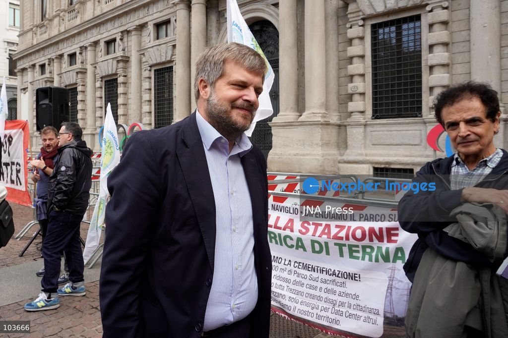 MILAN, ITALY – OCTOBER 10, 2026: Protesters gather for a sit-in in Piazza della Scala in central Milan to oppose the development of new data centers across Lombardy and Italy. The demonstration is organized by the Rete dei Comitati No Data Center (No Data Center Committee Network), which is calling for a moratorium on permits for new facilities. The group also urges public authorities to conduct thorough environmental, urban planning and regional assessments before approving projects. For approved facilities that have not yet begun operating, campaigners are calling for reviews to be reopened if potential microclimate effects and cumulative impacts with existing facilities were not adequately assessed. Lombardy is a major center for Italy’s data center industry. In 2024, the region hosted 67 of Italy’s 168 operational facilities and accounted for approximately 63% of applications for new developments, according to the supplied information. Photo by Calogero Russo / JNA Press. (Photo by calogero russo/JNA Press via Nexpher Images)