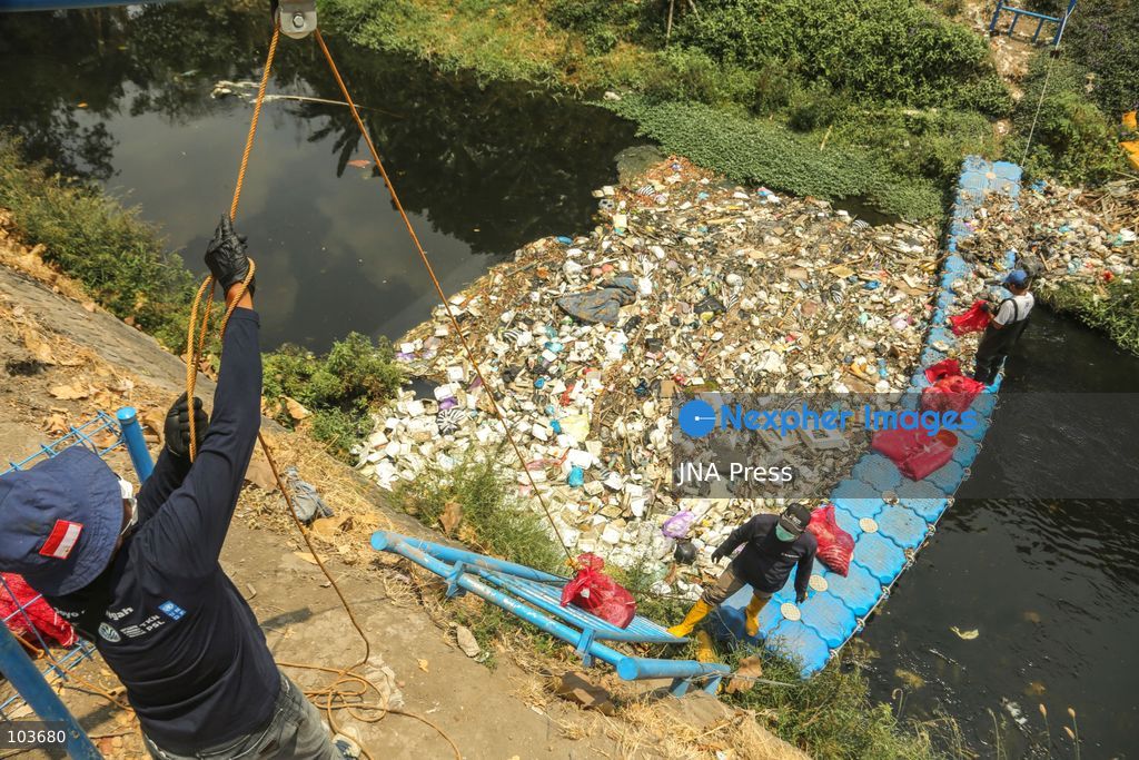 SOLO, CENTRAL JAVA, INDONESIA, OCTOBER 10, 2026: Volunteers collect and sort waste trapped by a trash boom installed in the Premulung River in Joyontakan, Solo, as part of the Sungai Lestari program aimed at reducing river pollution and strengthening community-based waste management. The initiative, involving UNDP Indonesia, the Bina Karta Lestari Foundation and the Joyo Gumregah community group, conducts waste collection three times a week, with organizers saying between 80 and 100 kilograms of waste is collected during each operation. The material is sorted into organic, inorganic and hazardous waste categories. Photo by Yoma Suryadi / JNA PRESS (Photo by Yoma Times Suryadi/JNA Press via Nexpher Images)