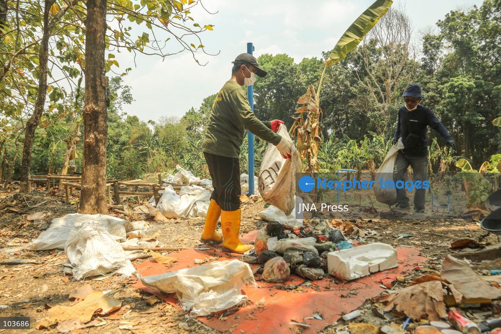 SOLO, CENTRAL JAVA, INDONESIA, OCTOBER 10, 2026: Volunteers collect and sort waste trapped by a trash boom installed in the Premulung River in Joyontakan, Solo, as part of the Sungai Lestari program aimed at reducing river pollution and strengthening community-based waste management. The initiative, involving UNDP Indonesia, the Bina Karta Lestari Foundation and the Joyo Gumregah community group, conducts waste collection three times a week, with organizers saying between 80 and 100 kilograms of waste is collected during each operation. The material is sorted into organic, inorganic and hazardous waste categories. Photo by Yoma Suryadi / JNA PRESS (Photo by Yoma Times Suryadi/JNA Press via Nexpher Images)