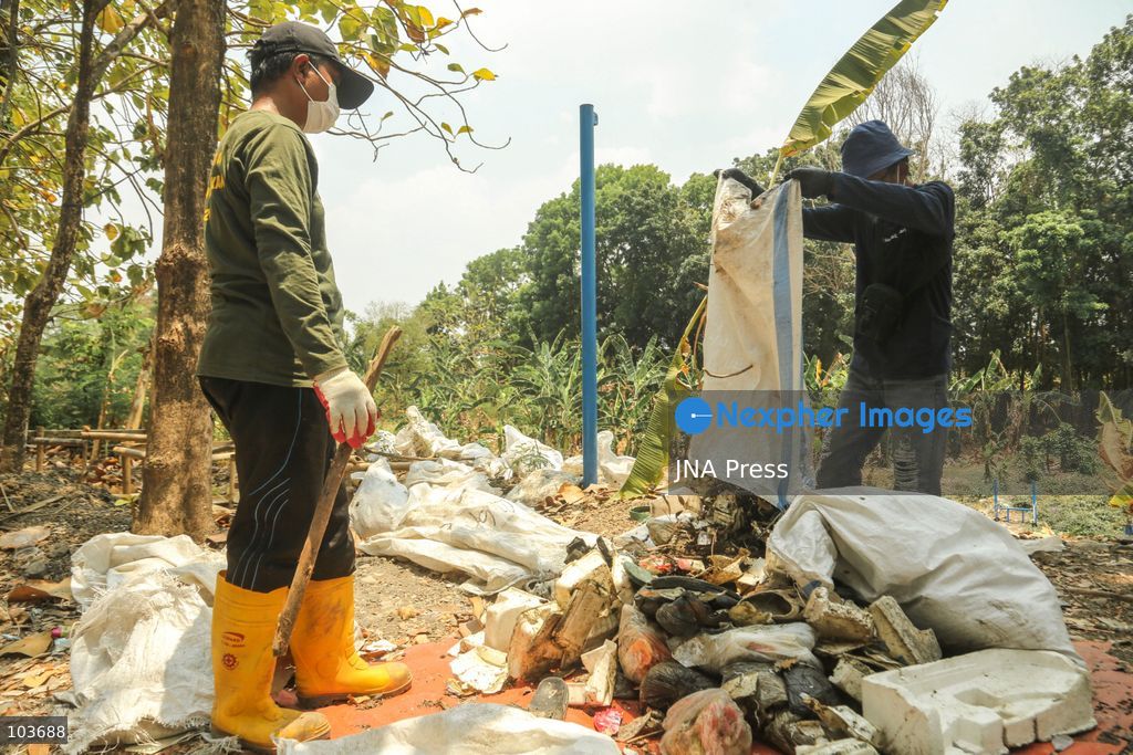 SOLO, CENTRAL JAVA, INDONESIA, OCTOBER 10, 2026: Volunteers collect and sort waste trapped by a trash boom installed in the Premulung River in Joyontakan, Solo, as part of the Sungai Lestari program aimed at reducing river pollution and strengthening community-based waste management. The initiative, involving UNDP Indonesia, the Bina Karta Lestari Foundation and the Joyo Gumregah community group, conducts waste collection three times a week, with organizers saying between 80 and 100 kilograms of waste is collected during each operation. The material is sorted into organic, inorganic and hazardous waste categories. Photo by Yoma Suryadi / JNA PRESS (Photo by Yoma Times Suryadi/JNA Press via Nexpher Images)