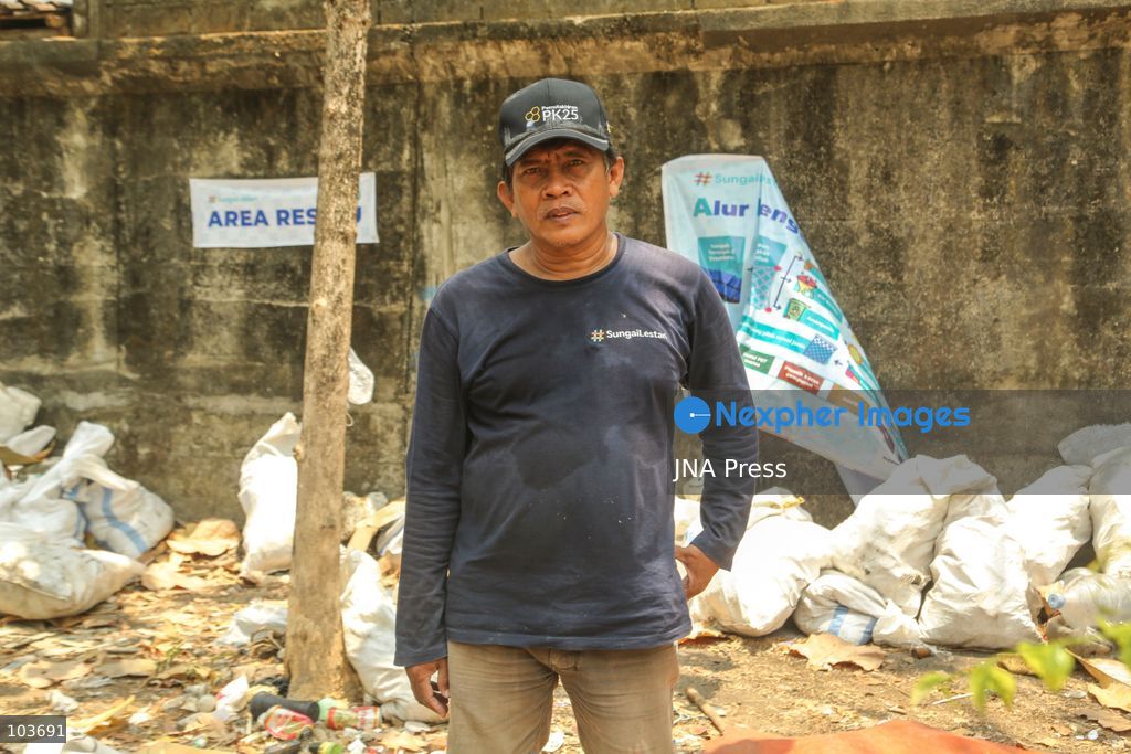 SOLO, CENTRAL JAVA, INDONESIA, OCTOBER 10, 2026: Volunteers collect and sort waste trapped by a trash boom installed in the Premulung River in Joyontakan, Solo, as part of the Sungai Lestari program aimed at reducing river pollution and strengthening community-based waste management. The initiative, involving UNDP Indonesia, the Bina Karta Lestari Foundation and the Joyo Gumregah community group, conducts waste collection three times a week, with organizers saying between 80 and 100 kilograms of waste is collected during each operation. The material is sorted into organic, inorganic and hazardous waste categories. Photo by Yoma Suryadi / JNA PRESS (Photo by Yoma Times Suryadi/JNA Press via Nexpher Images)