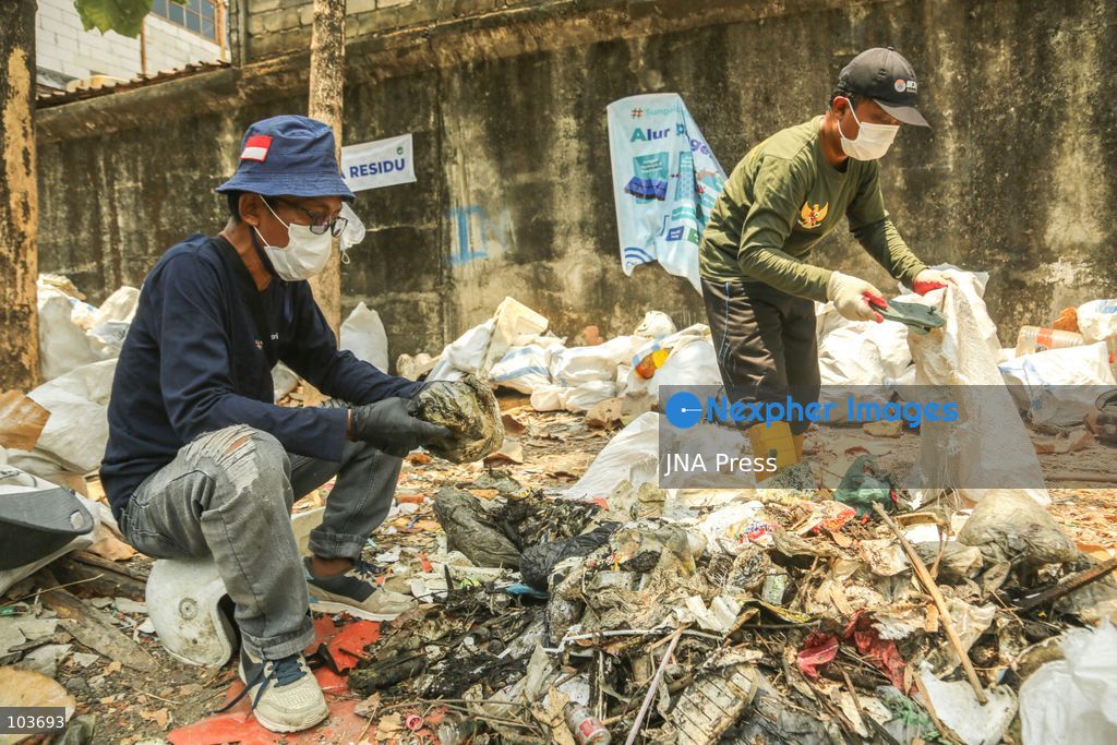 SOLO, CENTRAL JAVA, INDONESIA, OCTOBER 10, 2026: Volunteers collect and sort waste trapped by a trash boom installed in the Premulung River in Joyontakan, Solo, as part of the Sungai Lestari program aimed at reducing river pollution and strengthening community-based waste management. The initiative, involving UNDP Indonesia, the Bina Karta Lestari Foundation and the Joyo Gumregah community group, conducts waste collection three times a week, with organizers saying between 80 and 100 kilograms of waste is collected during each operation. The material is sorted into organic, inorganic and hazardous waste categories. Photo by Yoma Suryadi / JNA PRESS (Photo by Yoma Times Suryadi/JNA Press via Nexpher Images)