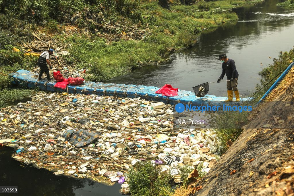 SOLO, CENTRAL JAVA, INDONESIA, OCTOBER 10, 2026: Volunteers collect and sort waste trapped by a trash boom installed in the Premulung River in Joyontakan, Solo, as part of the Sungai Lestari program aimed at reducing river pollution and strengthening community-based waste management. The initiative, involving UNDP Indonesia, the Bina Karta Lestari Foundation and the Joyo Gumregah community group, conducts waste collection three times a week, with organizers saying between 80 and 100 kilograms of waste is collected during each operation. The material is sorted into organic, inorganic and hazardous waste categories. Photo by Yoma Suryadi / JNA PRESS (Photo by Yoma Times Suryadi/JNA Press via Nexpher Images)