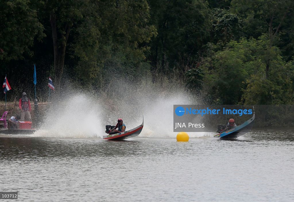 NAKHON SAWAN, THAILAND, OCTOBER 10, 2026: Competitors race traditional sword-headed boats during an annual boat racing festival in Nakhon Sawan province, north of Bangkok. The distinctive boats, adapted from local fishing vessels, feature upward-curving bows designed to help them move through vegetation while fishing. The races are traditionally held during the flood season ahead of the end of Buddhist Lent and have been staged in districts across Nakhon Sawan for more than two decades. Photo by Chaiwat Subprasom / JNA Press. (Photo by Chaiwat Subprasom/JNA Press via Nexpher Images)