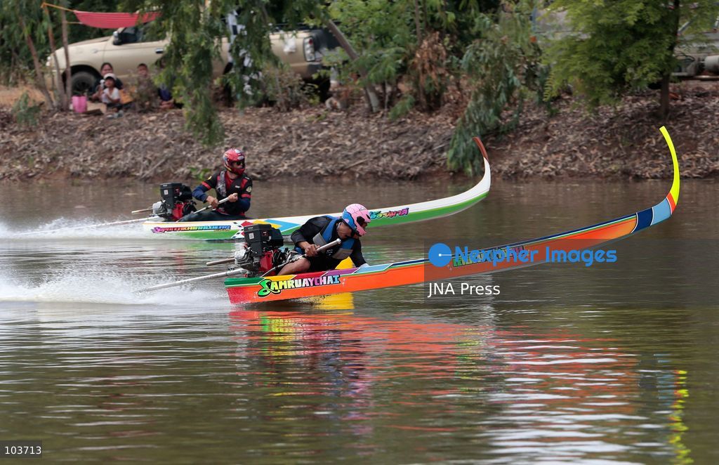 NAKHON SAWAN, THAILAND, OCTOBER 10, 2026: Competitors race traditional sword-headed boats during an annual boat racing festival in Nakhon Sawan province, north of Bangkok. The distinctive boats, adapted from local fishing vessels, feature upward-curving bows designed to help them move through vegetation while fishing. The races are traditionally held during the flood season ahead of the end of Buddhist Lent and have been staged in districts across Nakhon Sawan for more than two decades. Photo by Chaiwat Subprasom / JNA Press. (Photo by Chaiwat Subprasom/JNA Press via Nexpher Images)
