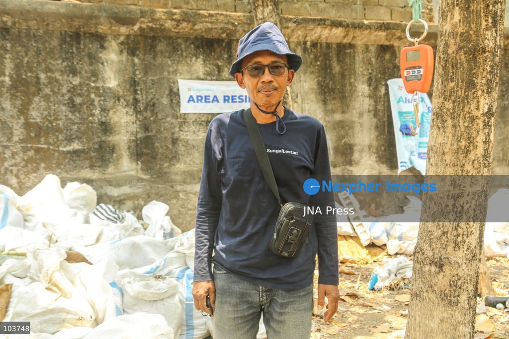 SOLO, CENTRAL JAVA, INDONESIA, OCTOBER 10, 2026: Volunteers collect and sort waste trapped by a trash boom installed in the Premulung River in Joyontakan, Solo, as part of the Sungai Lestari program aimed at reducing river pollution and strengthening community-based waste management. The initiative, involving UNDP Indonesia, the Bina Karta Lestari Foundation and the Joyo Gumregah community group, conducts waste collection three times a week, with organizers saying between 80 and 100 kilograms of waste is collected during each operation. The material is sorted into organic, inorganic and hazardous waste categories. Photo by Yoma Suryadi / JNA PRESS (Photo by Yoma Times Suryadi/JNA Press via Nexpher Images)