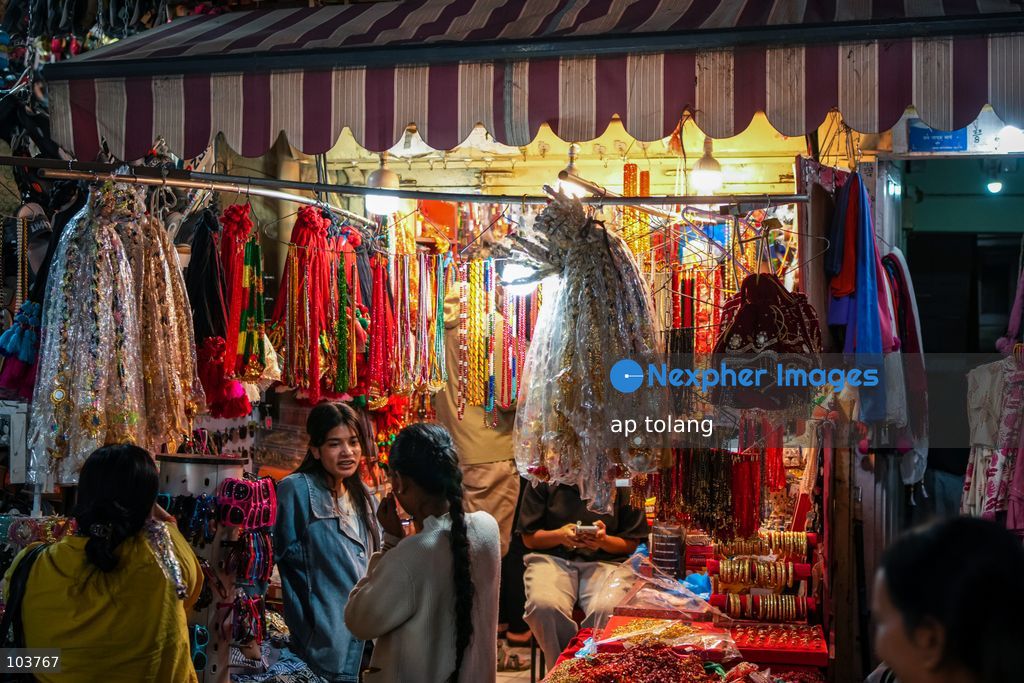 Lalitpur, NEPAL, October 10, 2026: People shop for clothes, footwear, and accessories at a busy market in Lalitpur, Nepal, ahead of the Dashain festival. Shoppers visit markets to purchase new clothes and other essentials for family gatherings and traditional celebrations. (Photo by ap tolang/Nexpher Images)